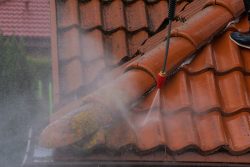 Washing,The,Old,Roof,With,Pressurized,Water